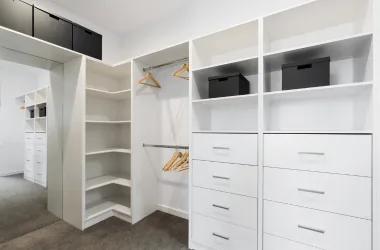 Well-organized walk-in closet with storage solutions